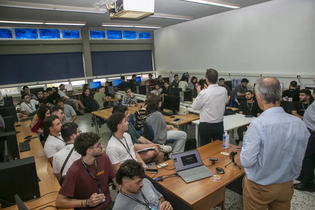 Instructor addressing students in a university computer lab