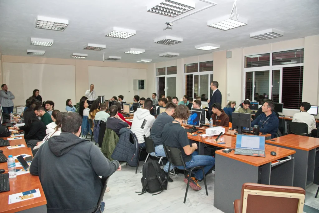 Students attending a computer lab class with instructors