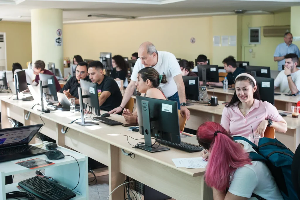 Students working on computers in a university lab setting