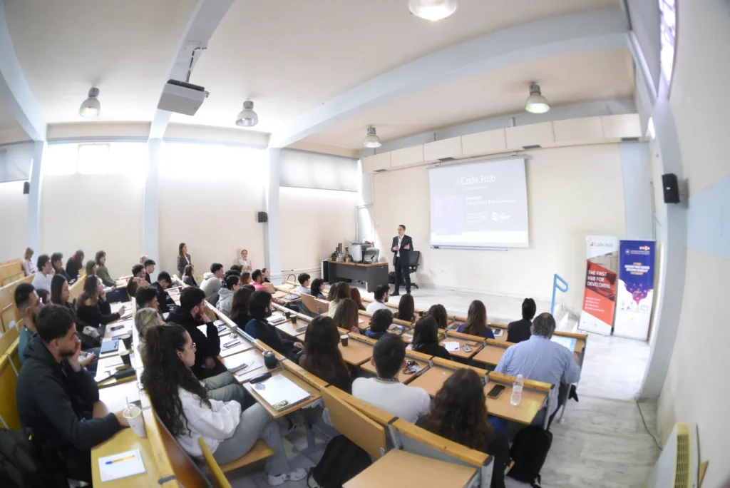 Speaker presenting Code.Hub seminar to university students in lecture hall