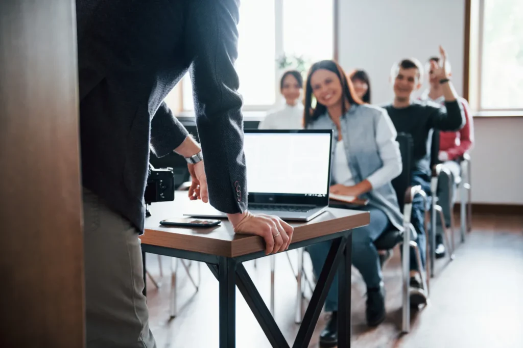 Instructor teaching engaged students in a modern classroom